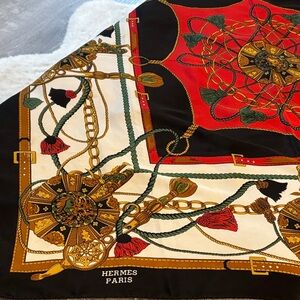 Hermès Silk Scarf with Red, Gold, and Black Design .  Hand rolled edges-